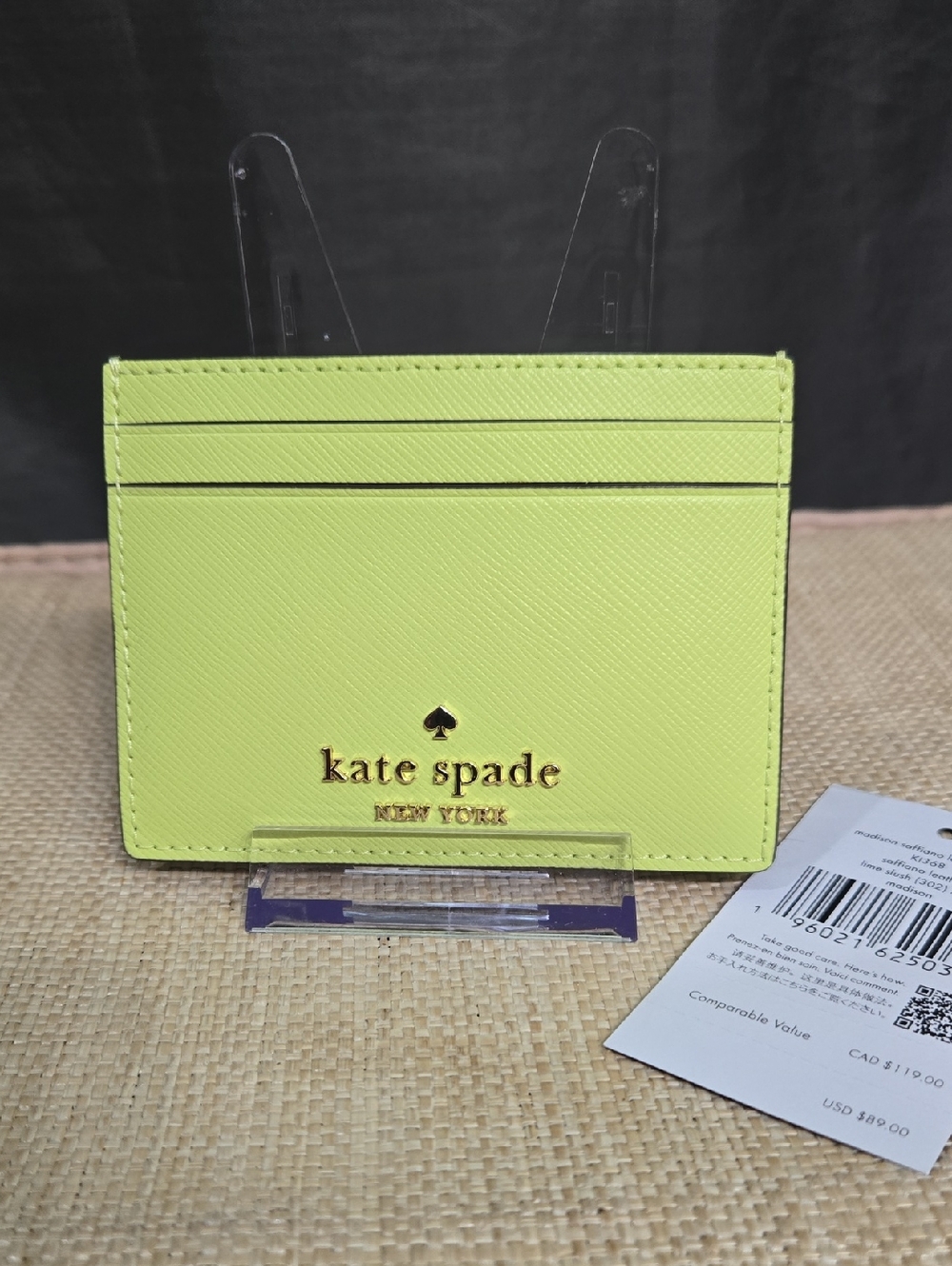 kate spade lime green card holder with gold logo